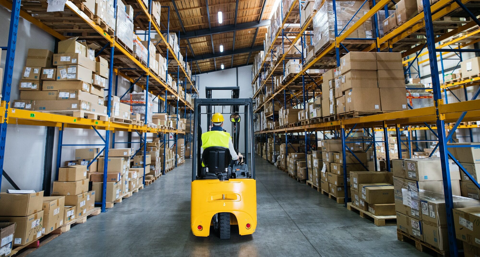 Warehouse man worker with forklift.