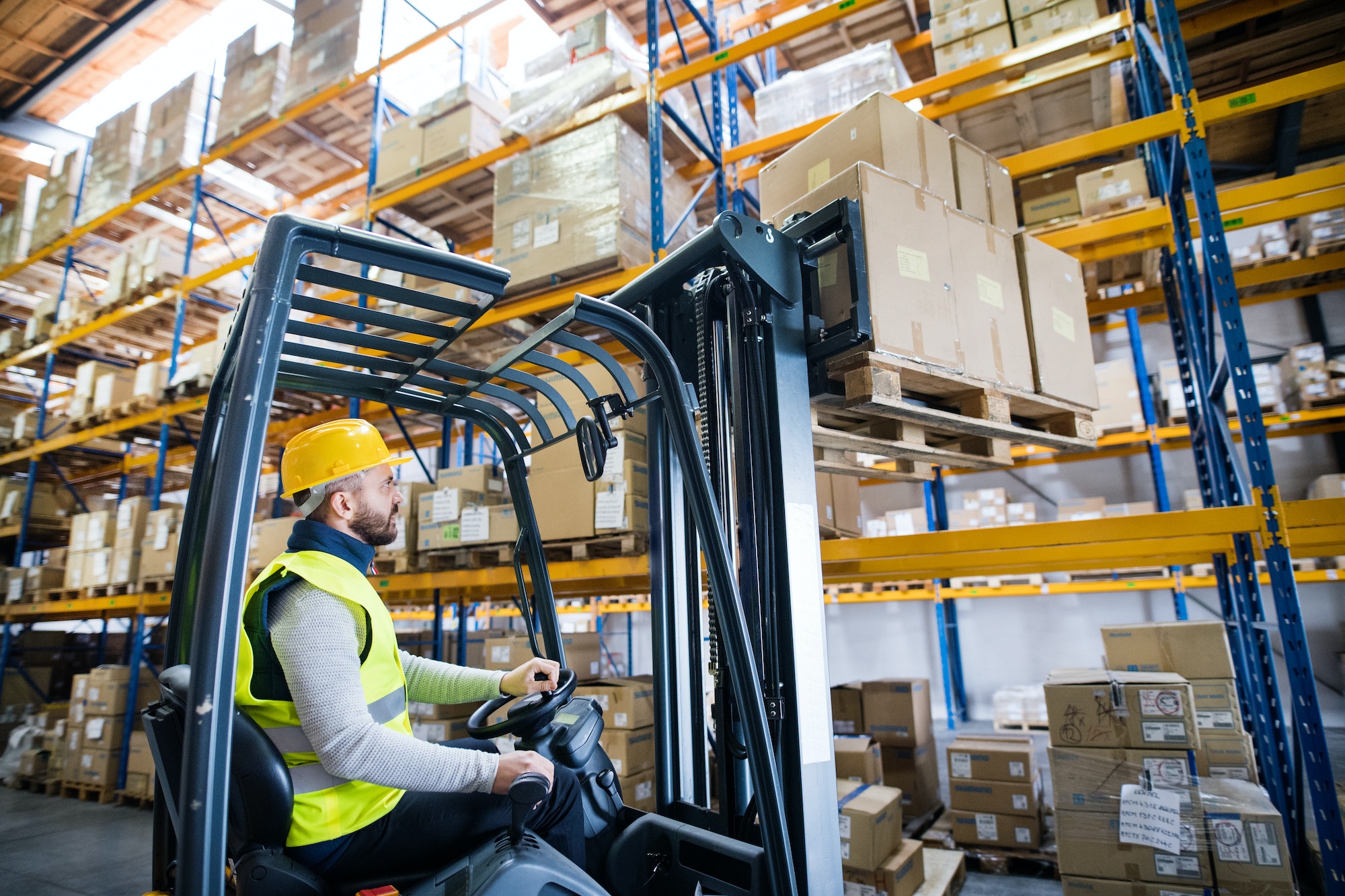 Warehouse man worker with forklift.